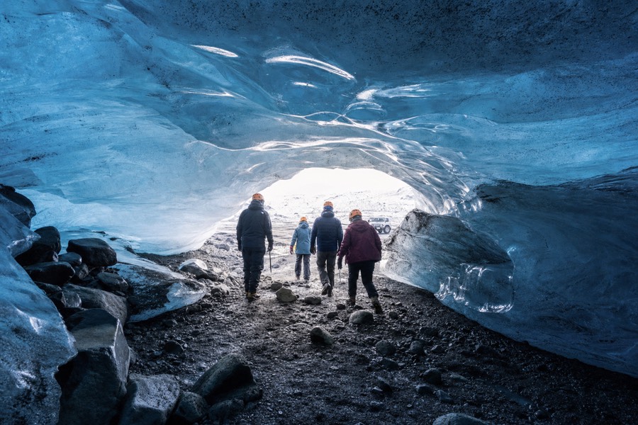 Inside a natural blue glacier ice cave under the Katla volcano area near Vik, Iceland